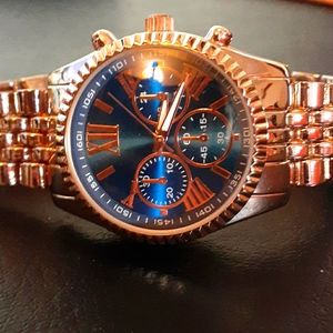 Blue faced Roman numeral watch